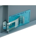 Self-adhesive label clamp for transport containers